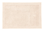 Rechteckige beige Badematte mit strukturiertem Feld in der Mitte