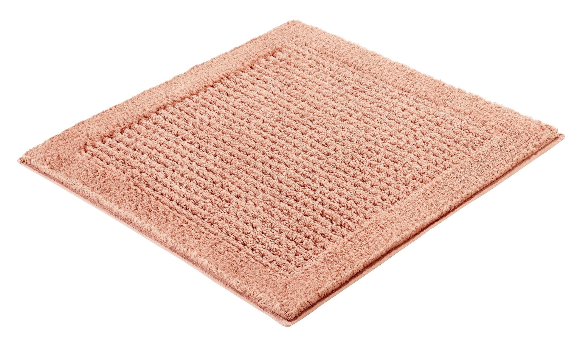 Badteppich NET Papaya 60 x 60 cm liegt als quadratischer, strukturierter Teppich auf hellem Untergrund.