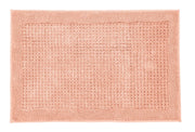 Badteppich NET Papaya 70 x 120 cm liegt flach und zeigt seine strukturierte Oberfläche.