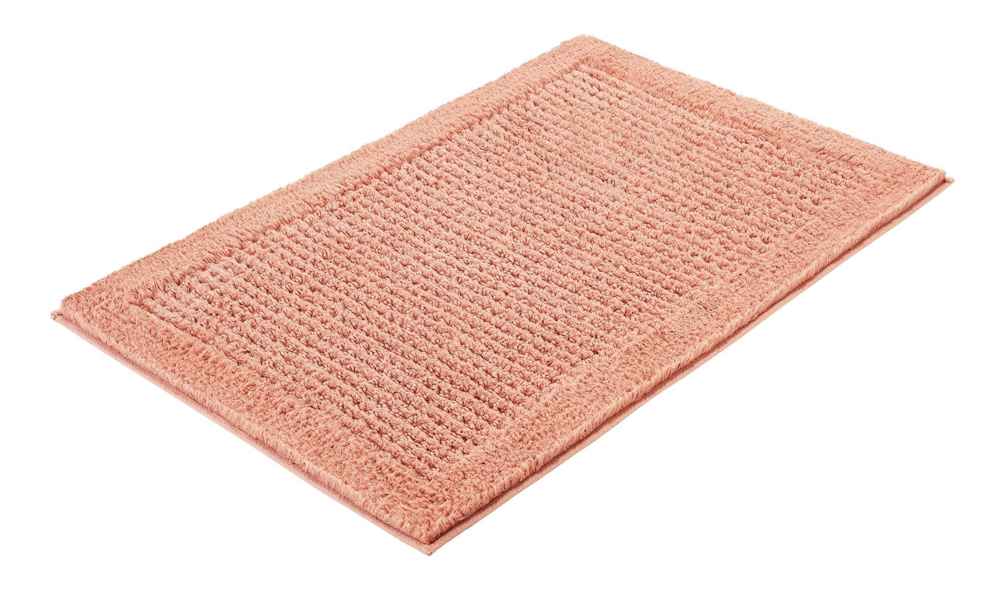Badteppich NET Papaya 80 x 140 cm liegt flach und zeigt seine strukturierte Oberfläche.