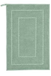 Badteppich NICO Maledivia 50 x 60 cm liegt flach, rechteckig und grün mit bordierter Struktur.