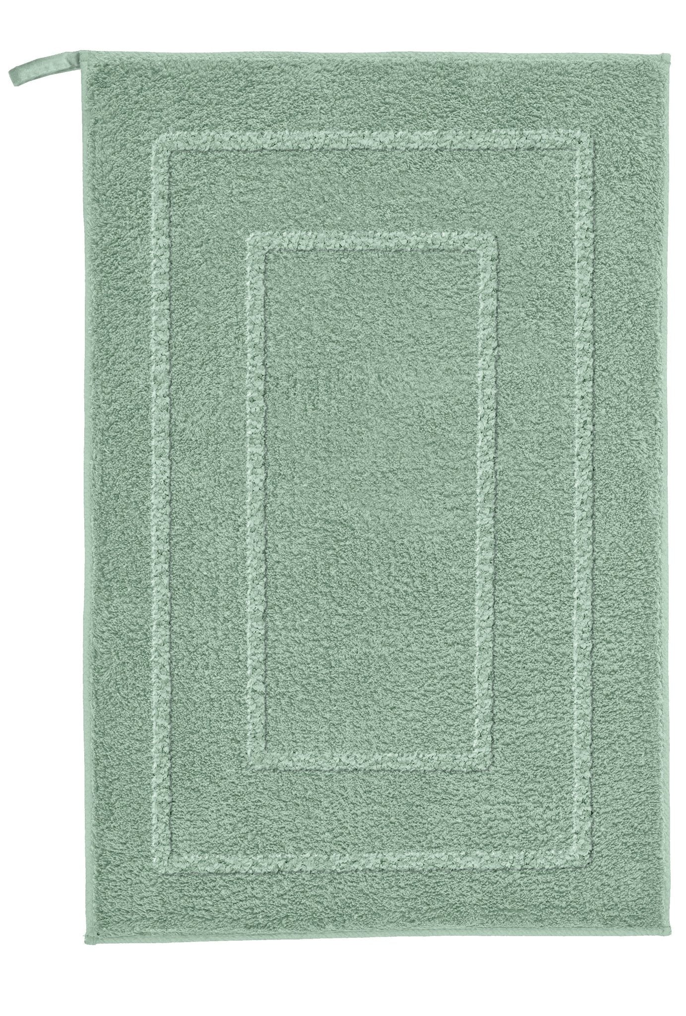 Badteppich NICO Maledivia 50 x 60 cm liegt flach, rechteckig und grün mit bordierter Struktur.