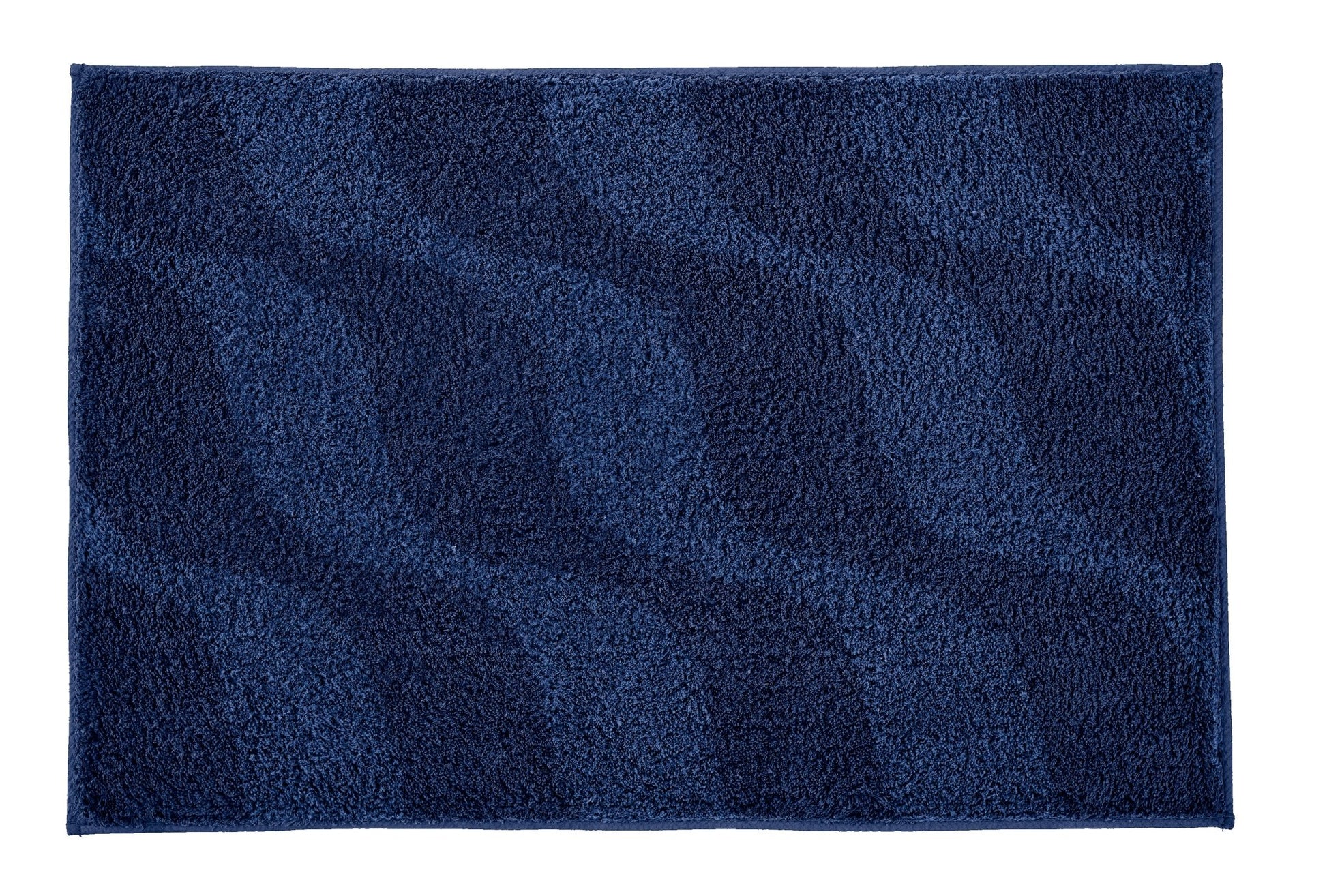 Badteppich ONDA Navy 60 x 90 cm liegt flach und zeigt sein wellenförmiges blaues Muster.