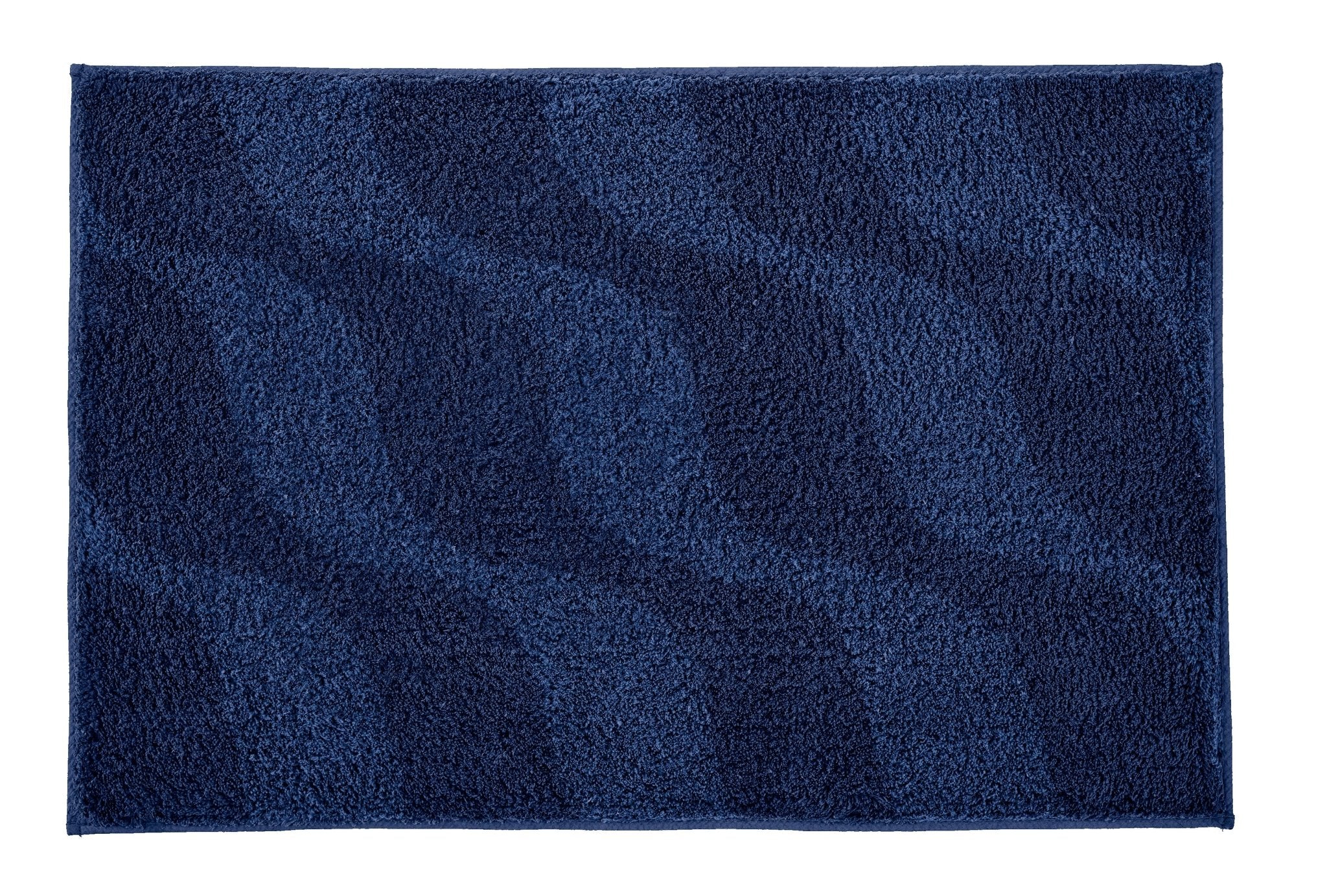 Badteppich ONDA Navy 60 x 90 cm liegt flach und zeigt sein wellenförmiges blaues Muster.