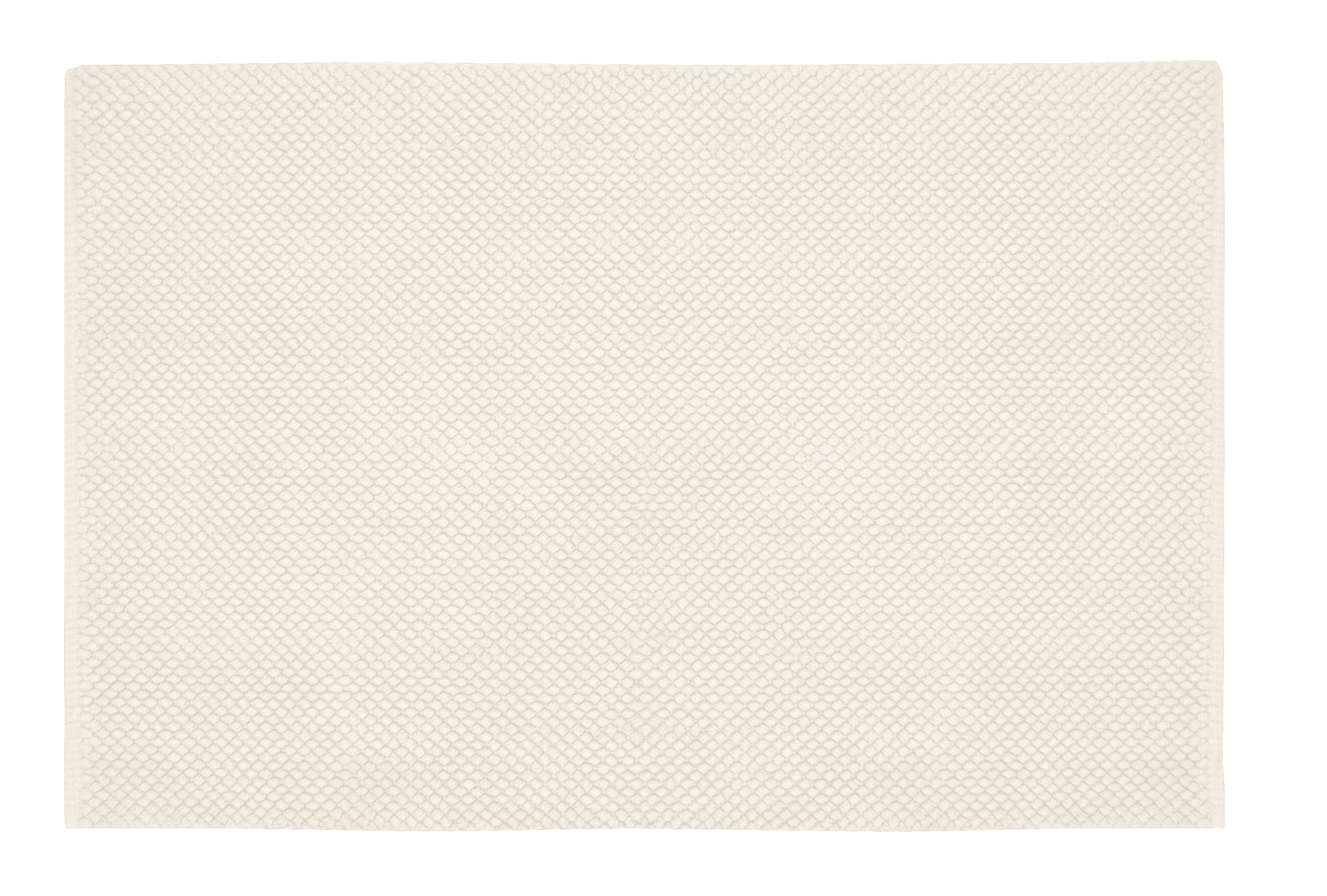 Cremefarbene Badematte mit feiner Wabenstruktur in Draufsicht von oben