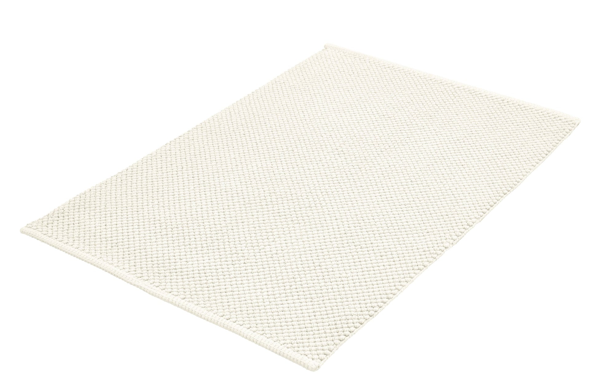 Rechteckige cremeweiße Badematte mit dichter, strukturierter Oberfläche