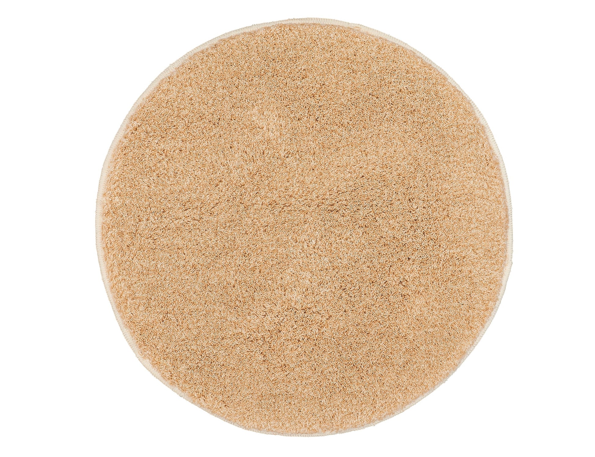 Runder Badteppich RELAX in Champagner mit 100 cm Durchmesser liegt auf hellem Untergrund.