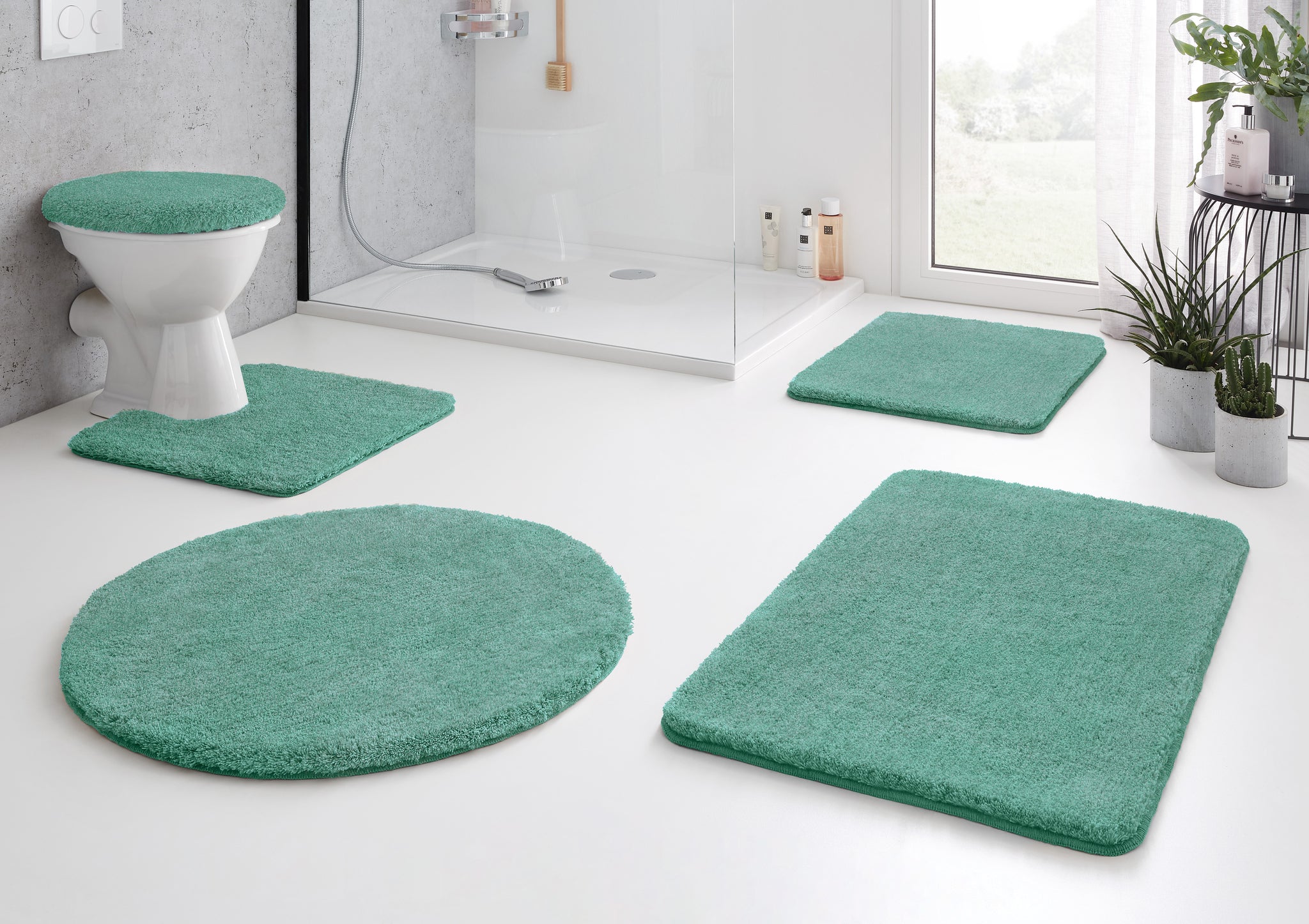 Türkisgrünes Badteppich-Set mit WC-Deckelbezug in modernem Bad
