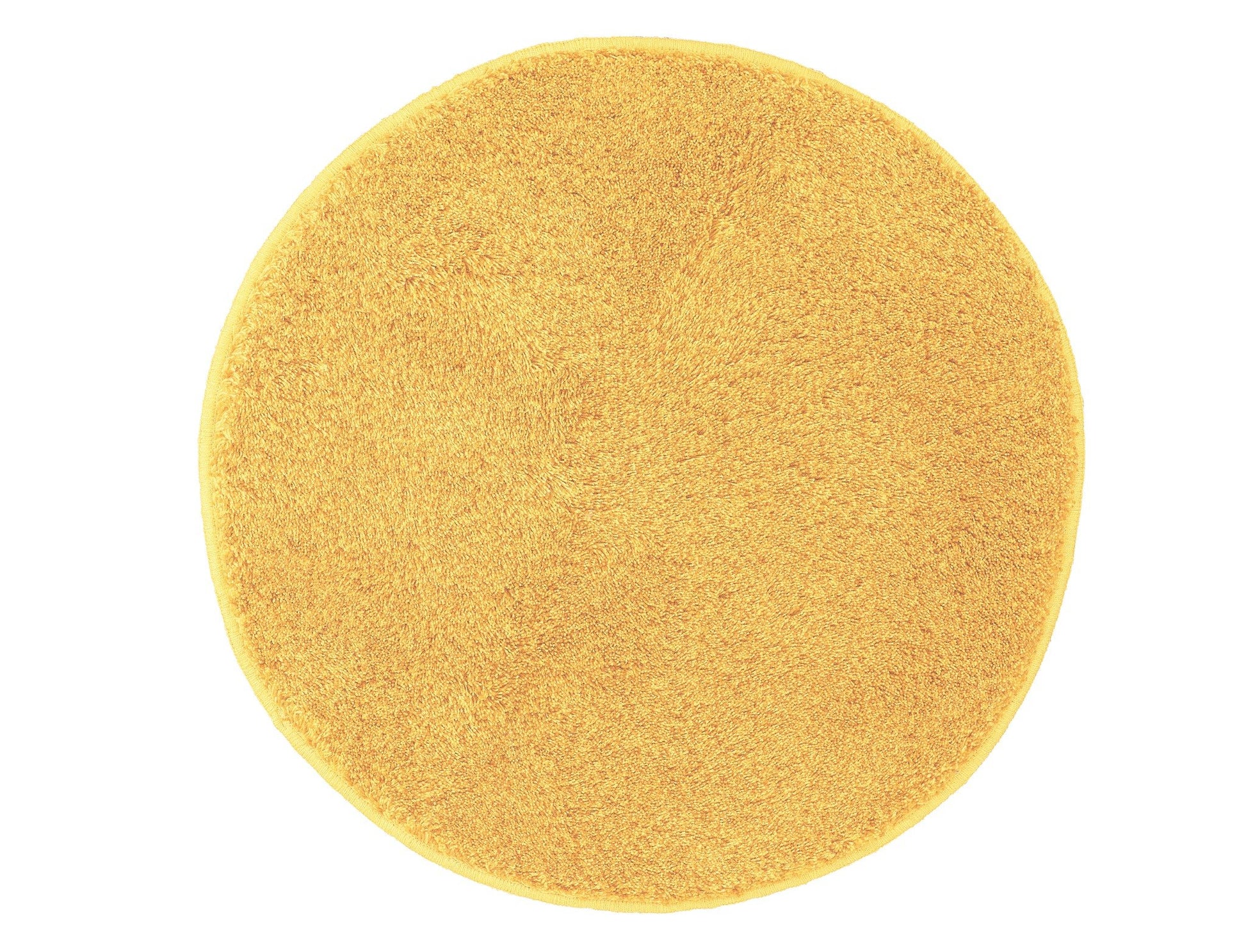 Runder Badteppich RELAX Mimose 100 cm in Gelb liegt flach auf hellem Hintergrund.