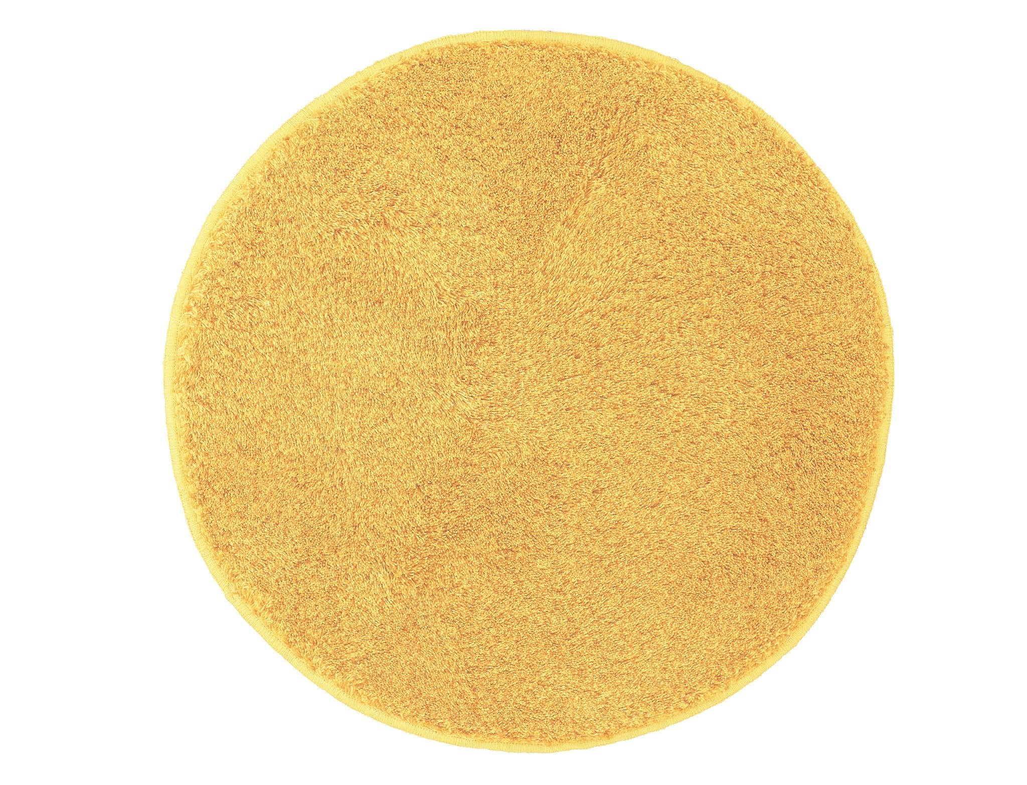 Runder Badteppich RELAX Mimose 100 cm in Gelb liegt flach auf hellem Hintergrund.