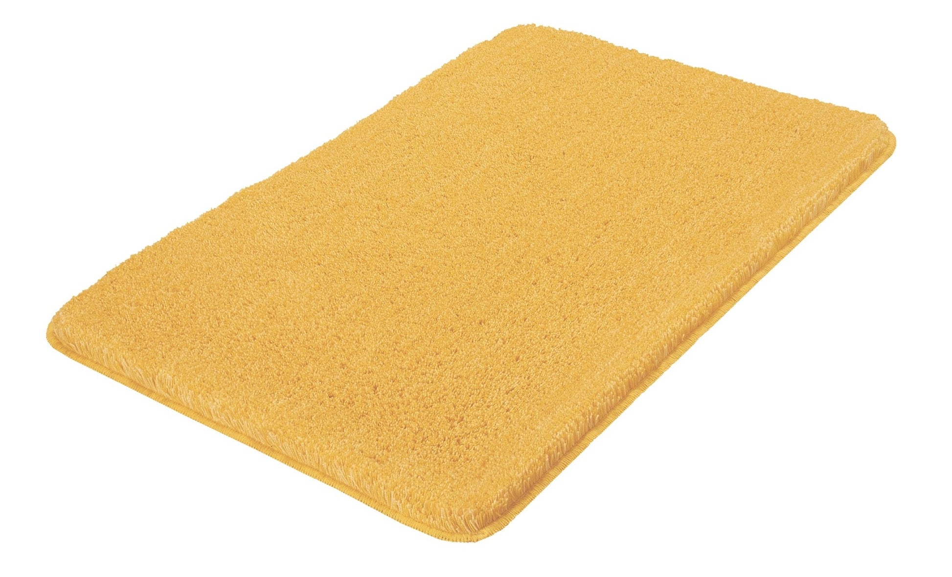 Badteppich RELAX Mimose 50 x 80 cm liegt rechteckig in gelber Farbe auf hellem Untergrund.