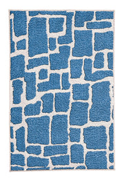 Blauer Badteppich mit cremefarbenem, abstraktem Steinmuster.