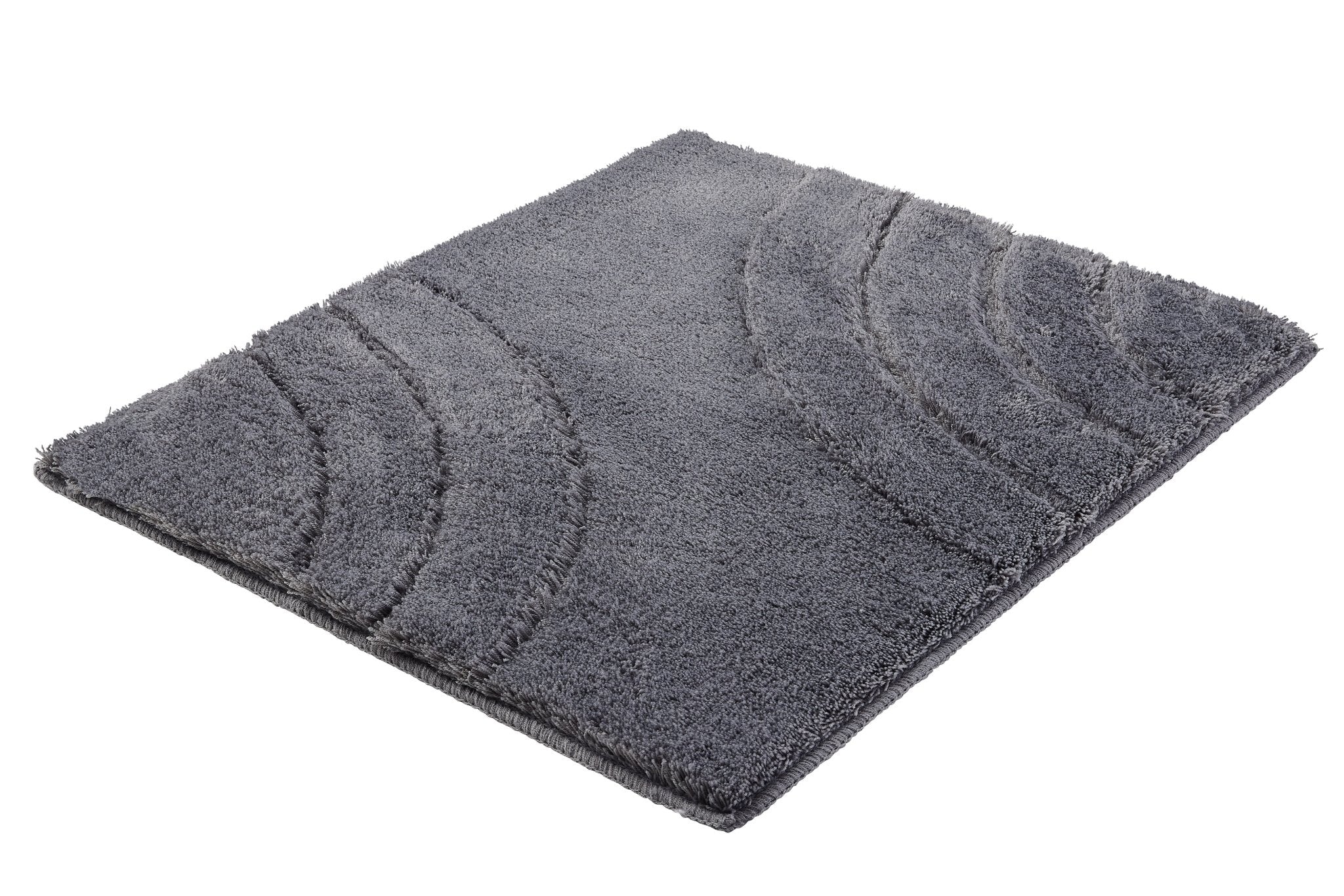 Badteppich SATURN in Anthrazit 55 x 65 cm liegt flach mit gebogenen Konturen auf weißem Hintergrund.