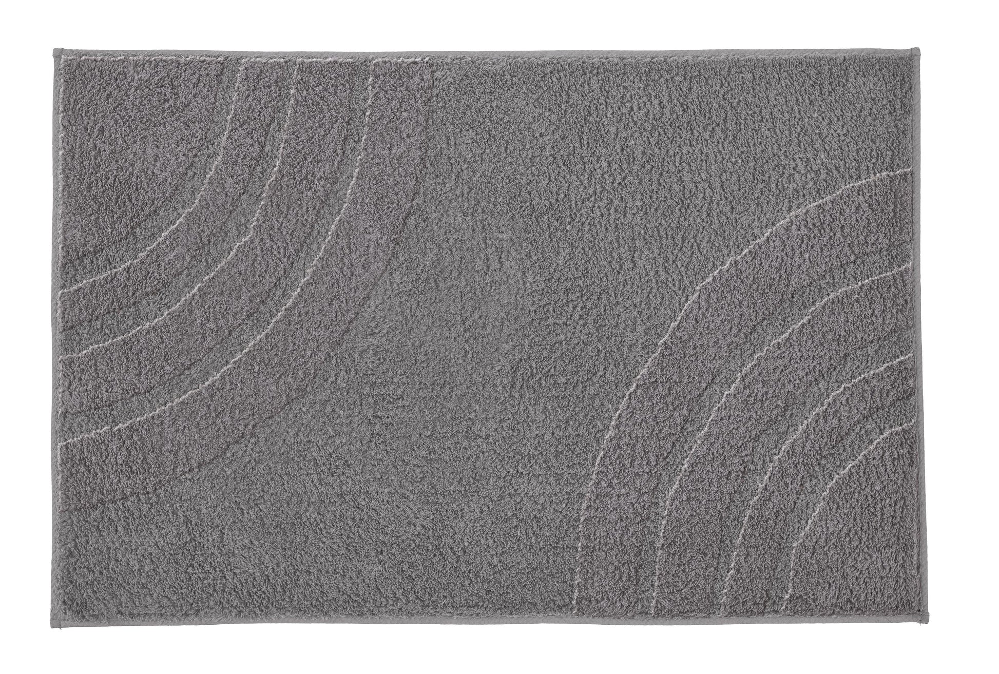 Grauer Badteppich SATURN Navy mit dezentem Bogenmuster liegt flach auf hellem Hintergrund.