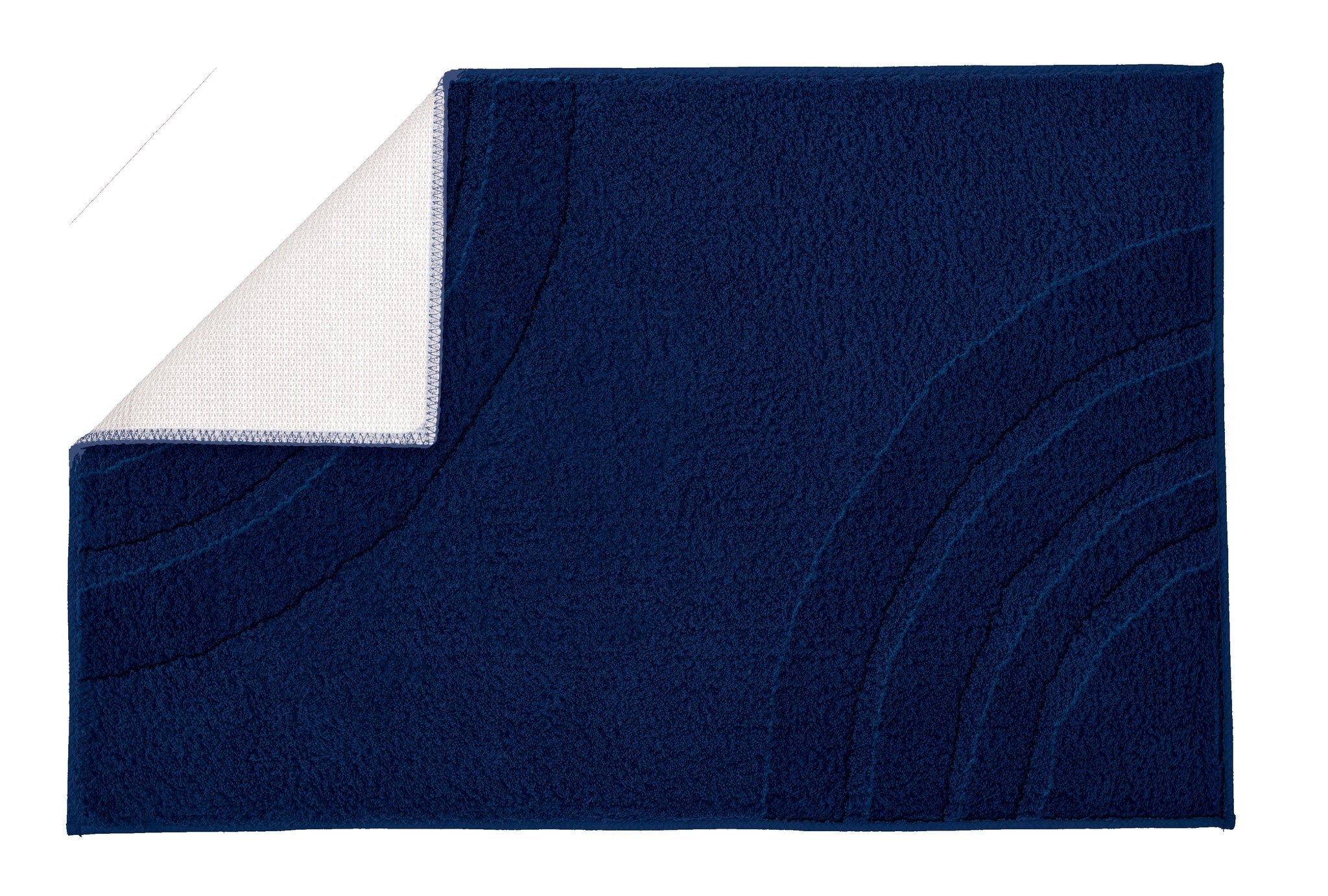 Badteppich SATURN Navy 80 x 140 cm liegt aufgeklappt mit sichtbarer Rückseite auf hellem Untergrund.
