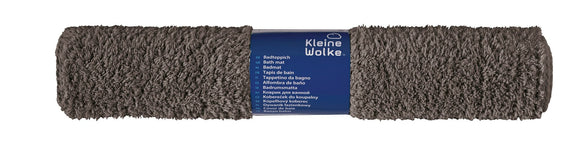 Graue rechteckige Badematte mit dichtem Flor, gerollt mit Etikett