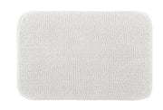 Weiße rechteckige Badematte mit weicher, strukturierter Oberfläche unten