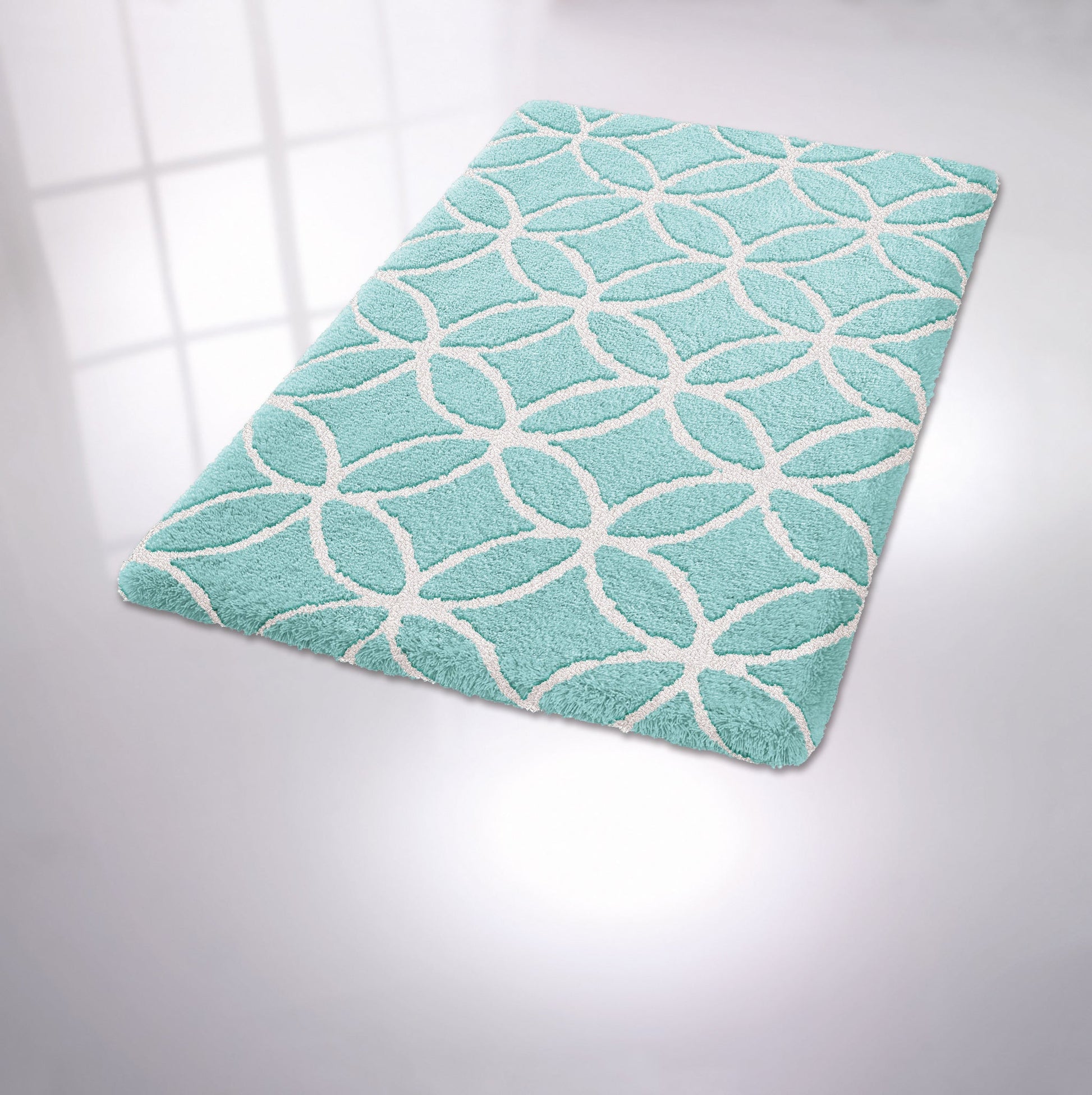 Türkiser Badezimmerteppich mit weißem, kreisförmigem Rautenmuster