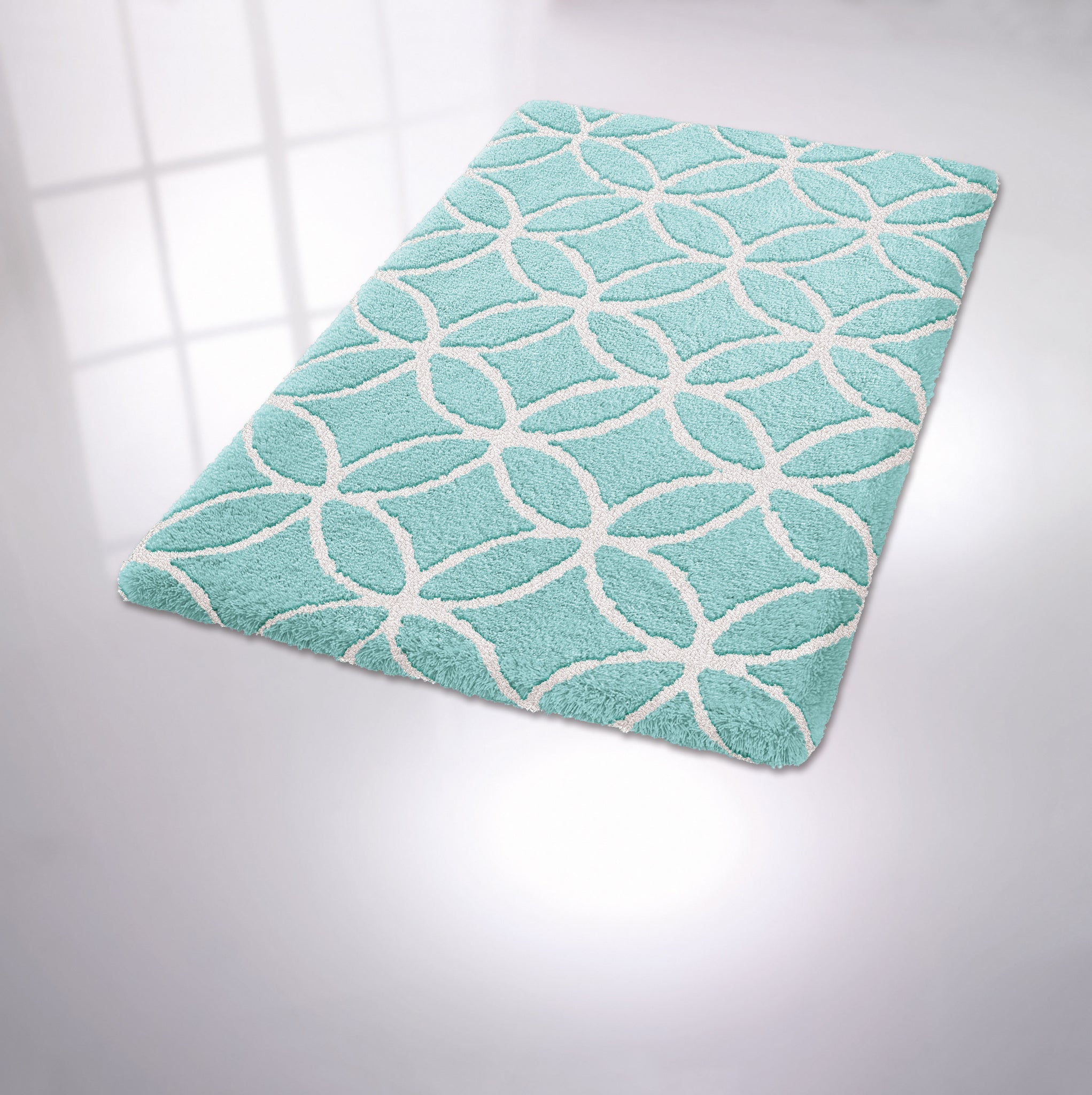 Türkiser Badezimmerteppich mit weißem, kreisförmigem Rautenmuster