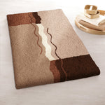 Badematte in Beige und Braun mit abstraktem Wellenmuster Design