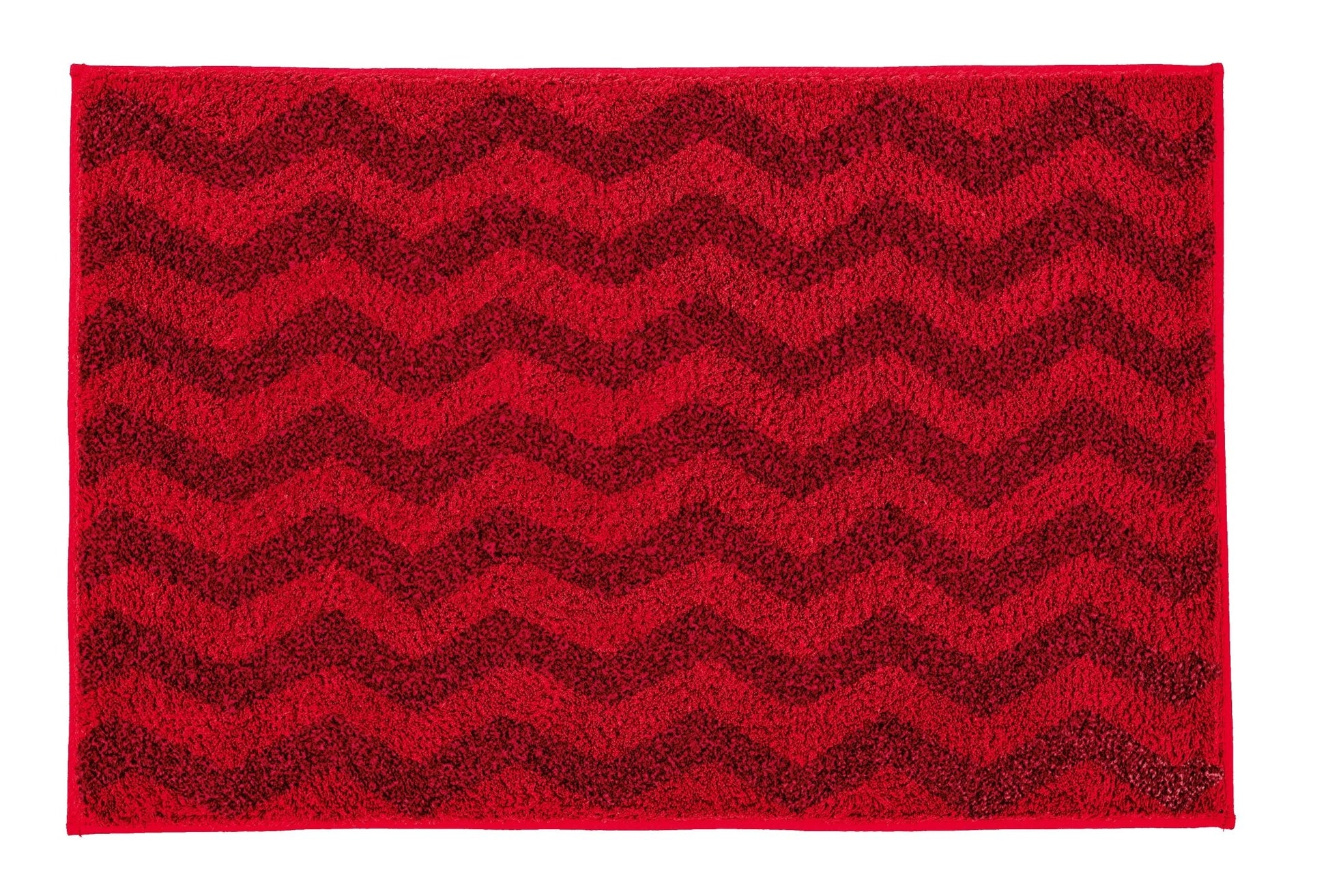 Badteppich ZACK Rubin 70 x 120 cm in Rot mit Zickzackmuster liegt flach auf dem Boden.