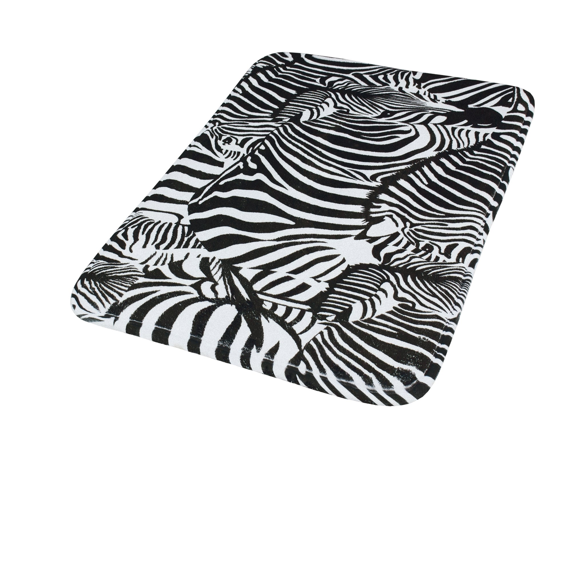 Der Badteppich ZEBRA in Schwarz-Weiß 40 x 60 cm liegt mit Zebramuster auf weißem Hintergrund.