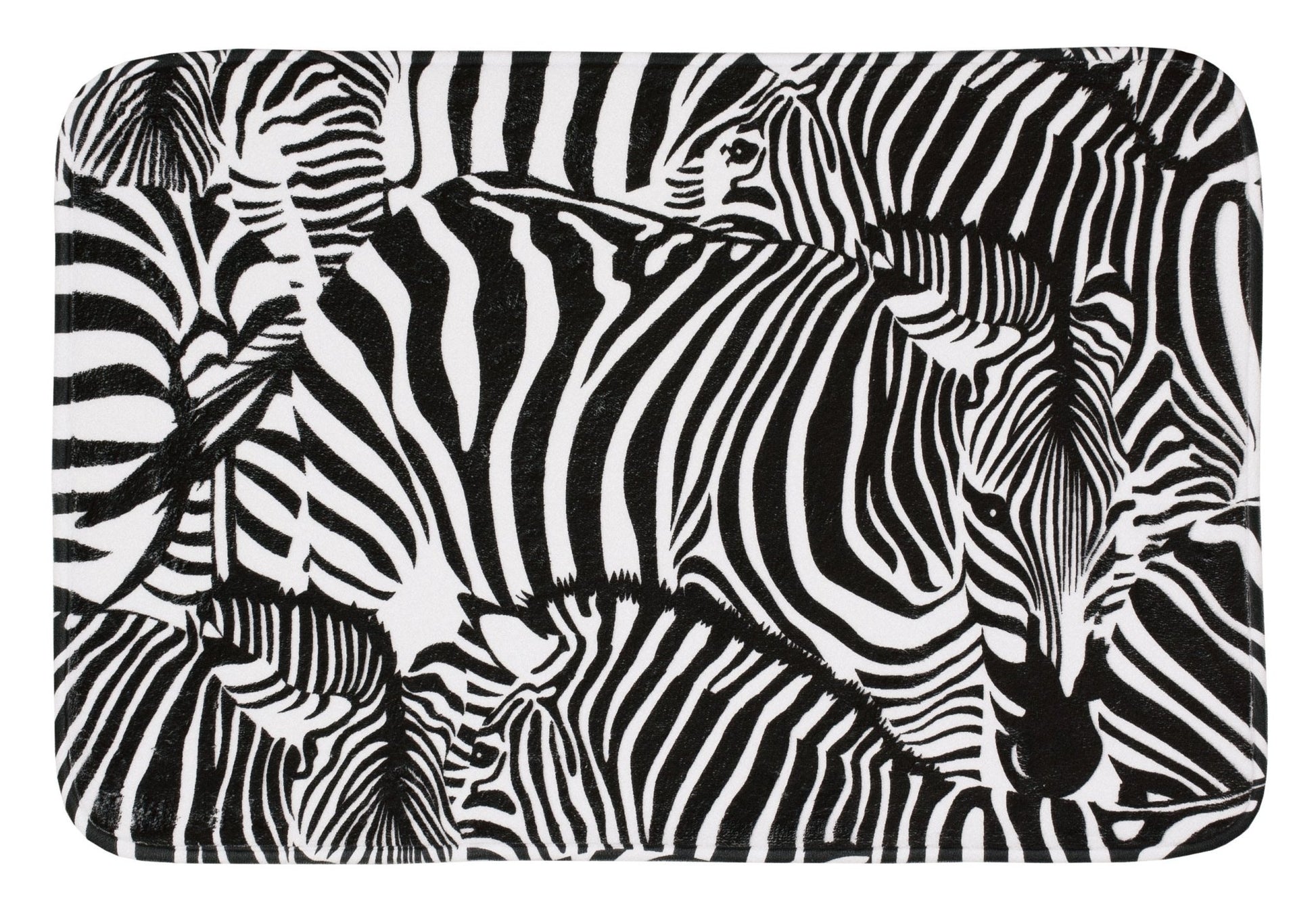 Badteppich ZEBRA in Schwarz-Weiß 40 x 60 cm zeigt dicht angeordnete Zebraköpfe und Streifen.
