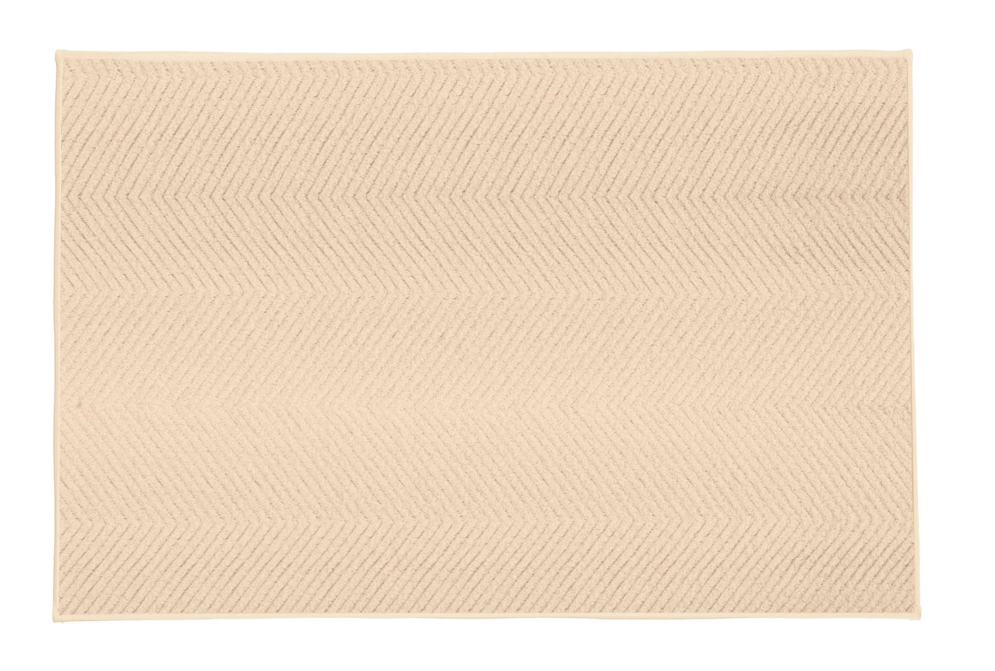 Beiger Badematte mit dezentem Fischgrätmuster auf hellem Hintergrund