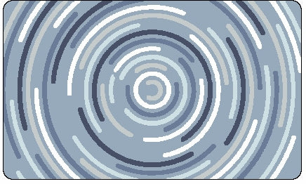 Badteppich mit konzentrischem Kreisdekor in Blau, Grau und Weiß liegt auf dem Boden.