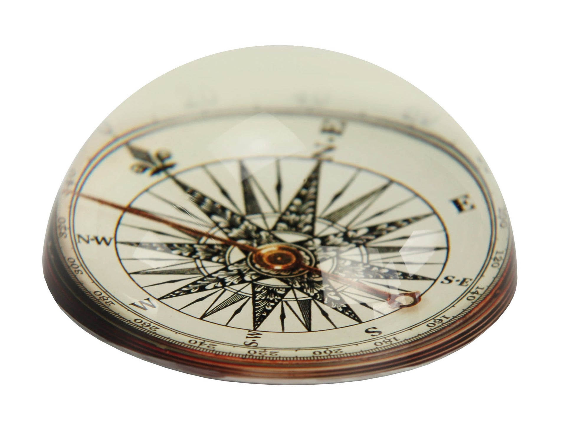 Deko COMPASS Clear M liegt als gläserne Kompass-Deko mit Windrose auf einer hellen Fläche.