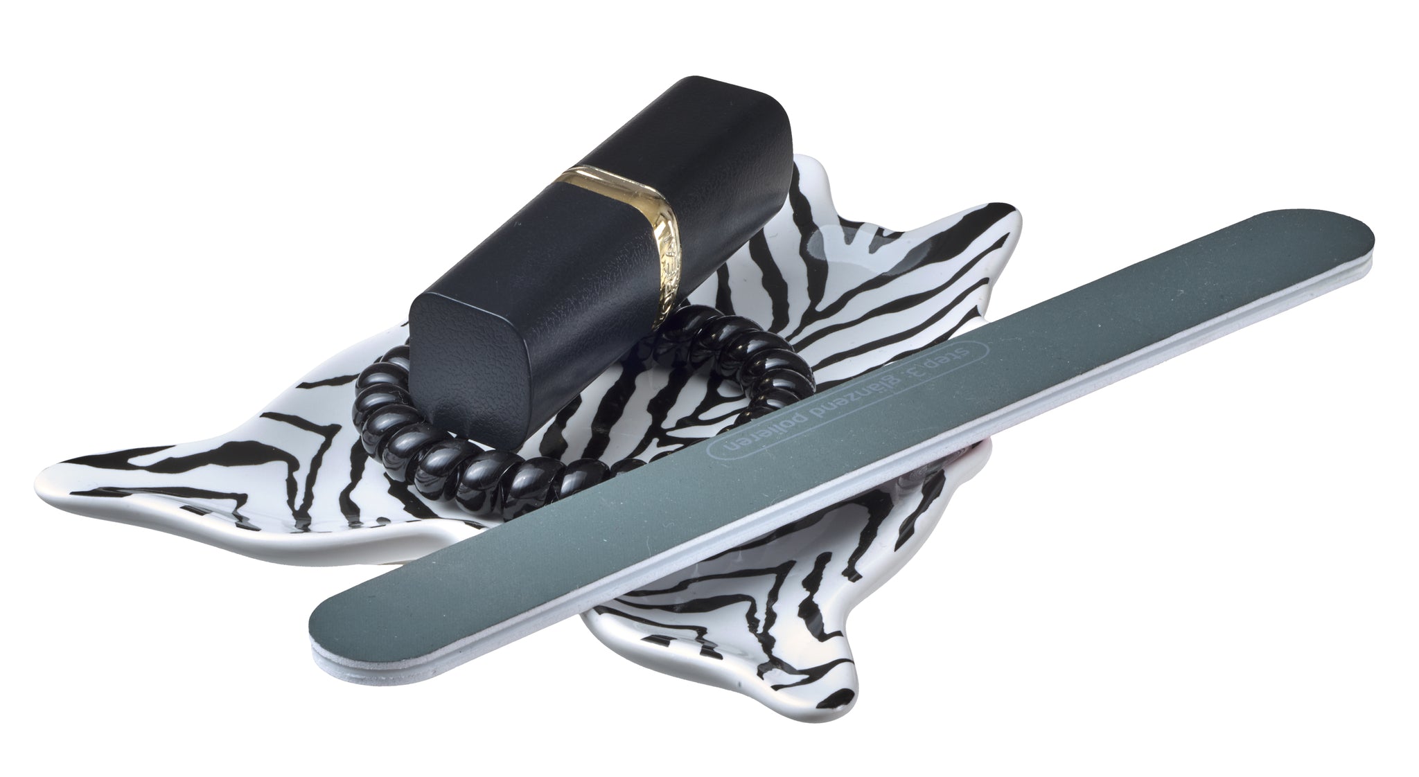 Seifenschale mit Zebramuster, Nagelfeile, schwarzem Lippenstift und Haargummi