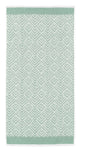 Mintgrünes Handtuch mit weißem, kleinteiligem geometrischem Muster