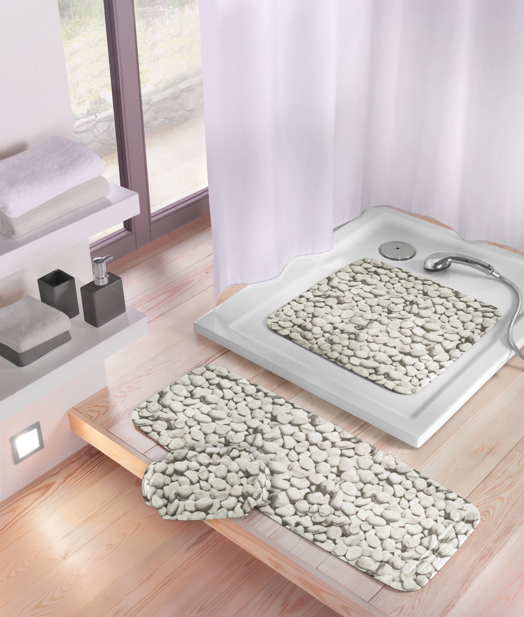 Nackenpolster STEPSTONE grau in Steinoptik im modernen Bad auf Wannenrand neben passender Badematte.