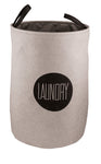 Runder, grauer Wäschekorb aus Stoff mit schwarzem Schriftzug LAUNDRY