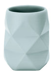 Zahnputzbecher aus hellblauem Keramik mit geometrischer Oberfläche
