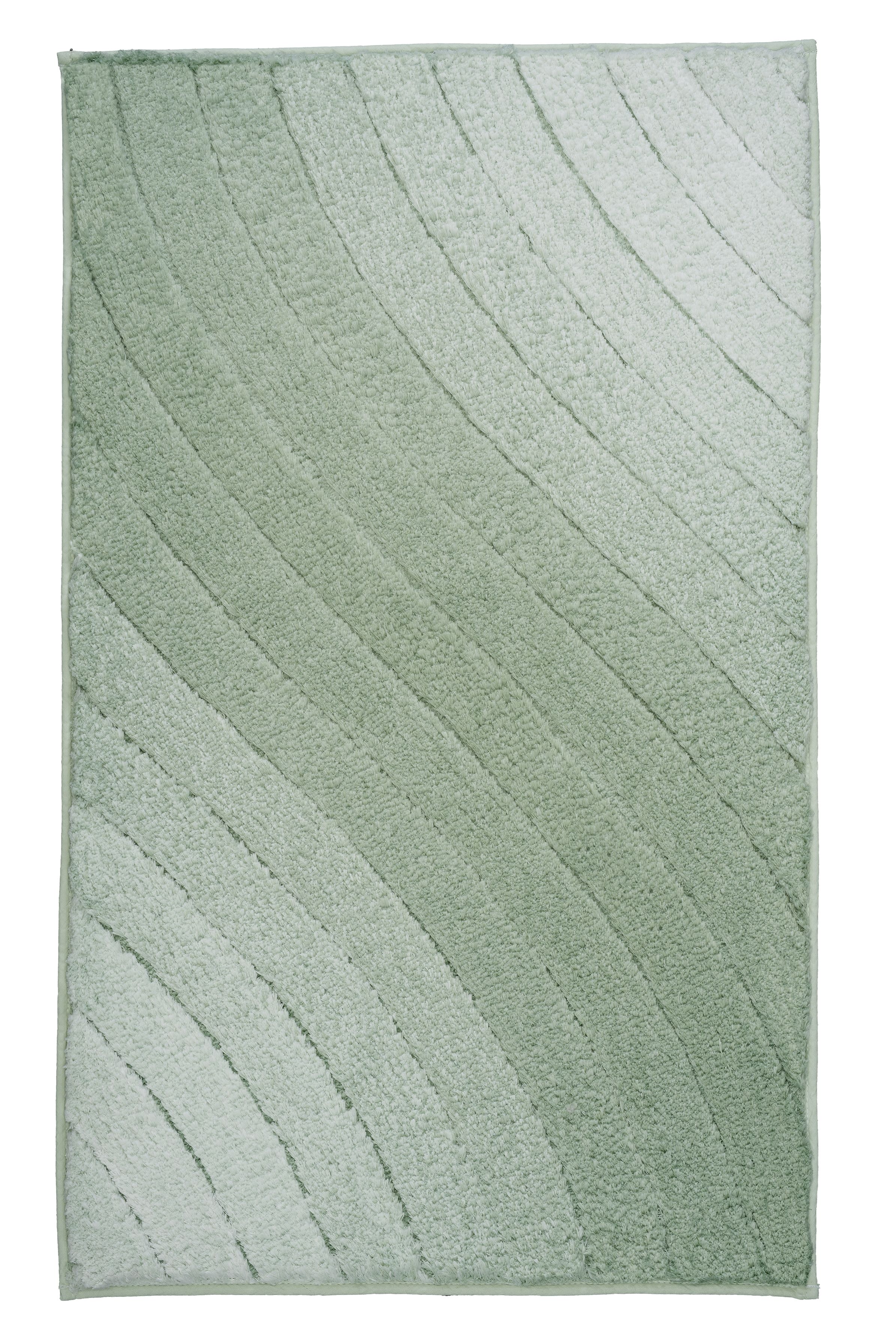 Weicher, grüner Badteppich mit wellenförmigem Muster, ideal für ein modernes Badezimmer.