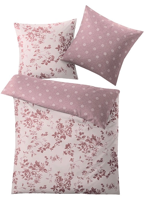 Bettwäsche-Set mit floralem Muster in Rosa und Weiß. Kissenbezug mit zarten Blüten. Weiche, hochwertige Materialien für gemütliche Nächte.