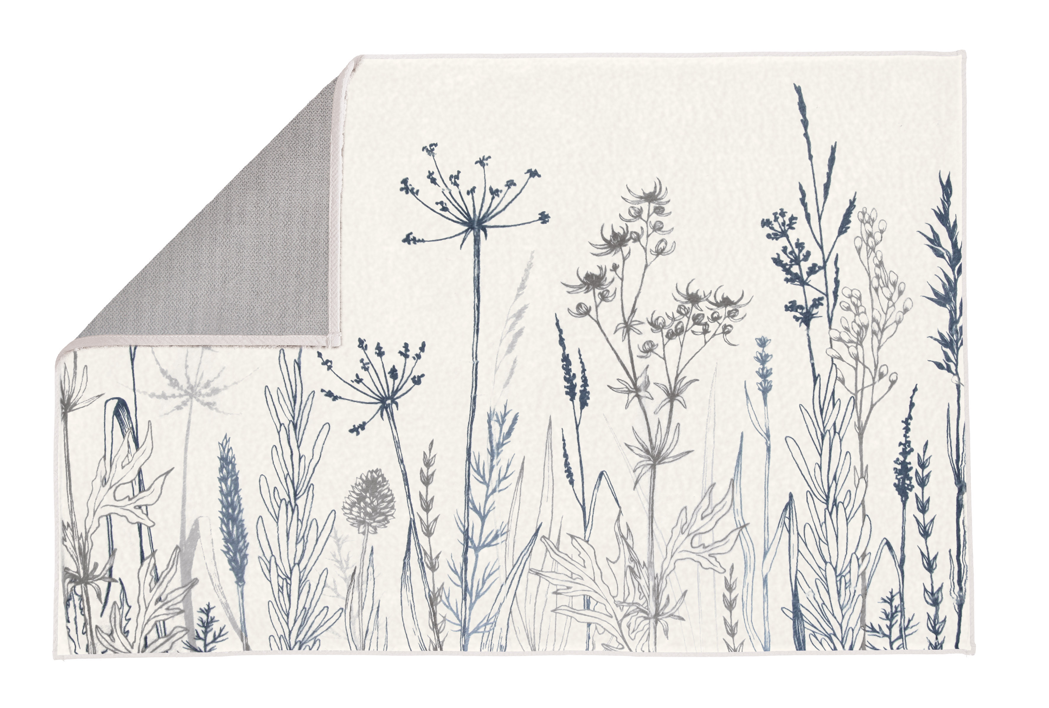 Badematte mit floralem Design in Blau- und Grautönen, umgeschlagene Ecke zeigt rutschfeste Rückseite. Ideal für ein stilvolles Badezimmer.