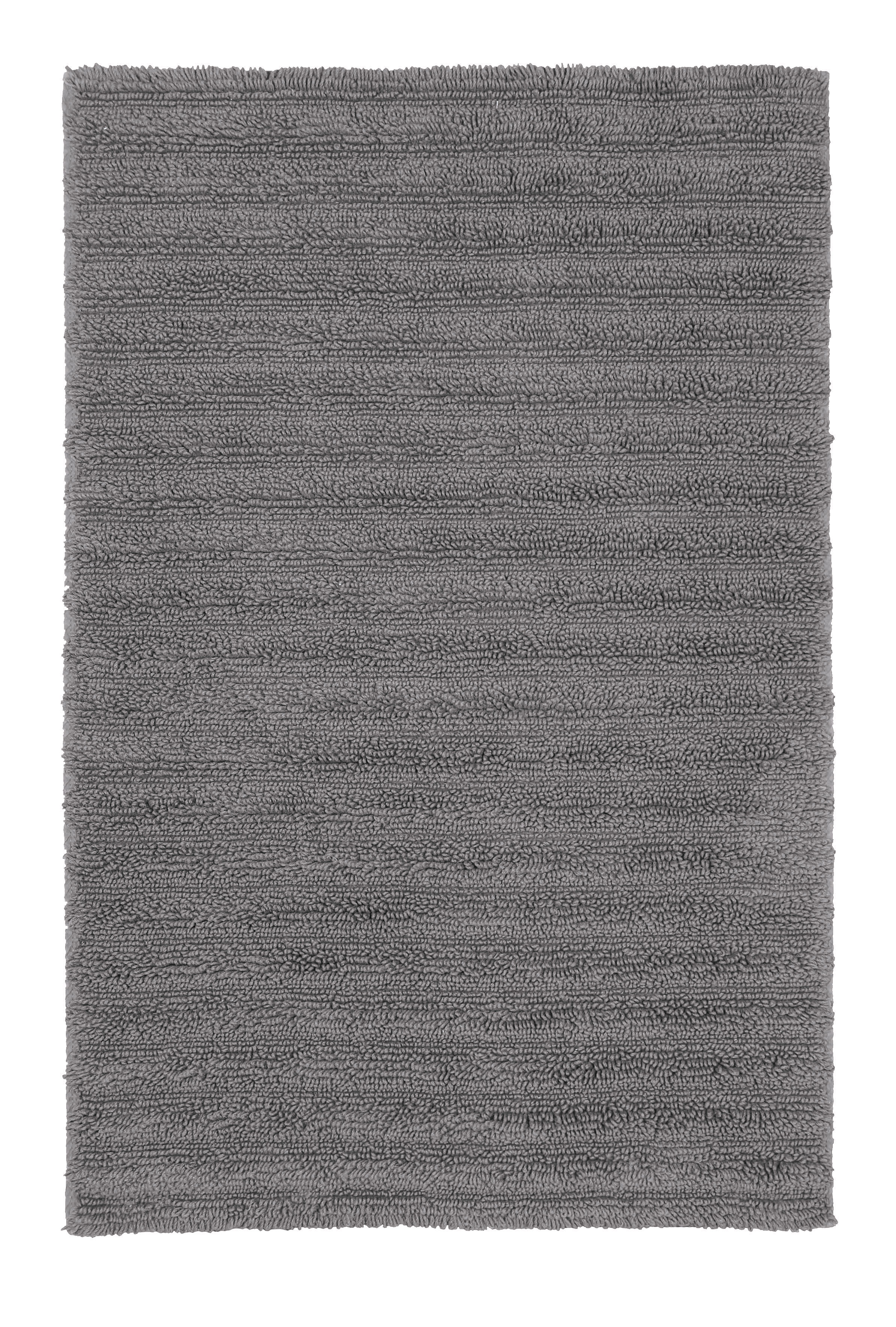 Grauer, rechteckiger Badteppich mit weicher, strukturierter Oberfläche. Ideal für ein modernes Badezimmer.