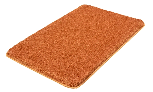 Weicher, orangefarbener Badteppich mit rutschfester Unterseite, ideal für ein gemütliches Badezimmer.