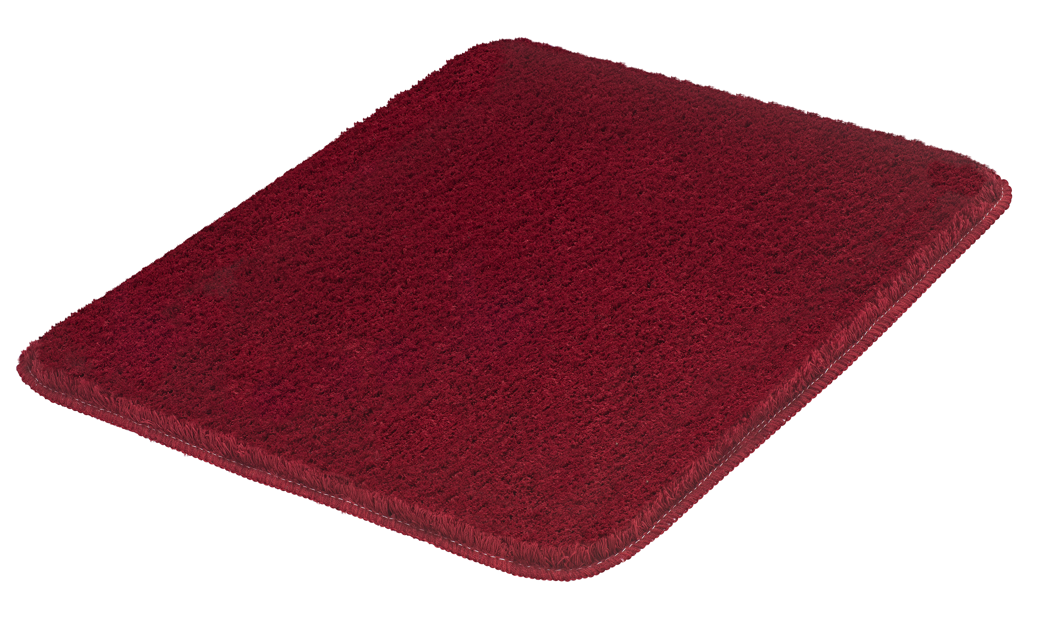 Rote Badematte mit weicher, flauschiger Oberfläche und rutschfester Unterseite, ideal für Badezimmer und Wellnessbereiche.