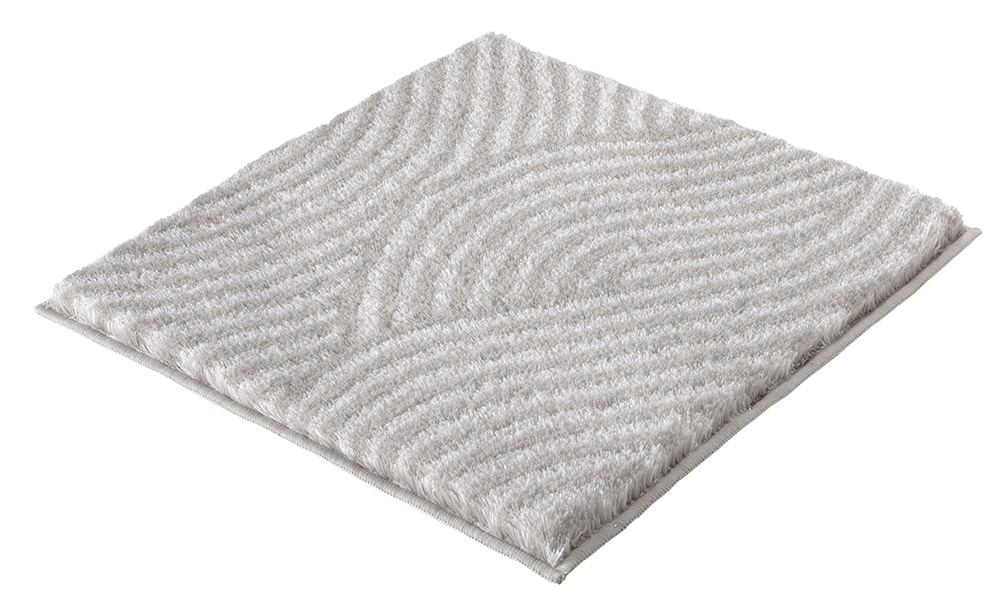 Weißer, quadratischer Badteppich mit wellenförmigem Muster und weicher, flauschiger Textur.