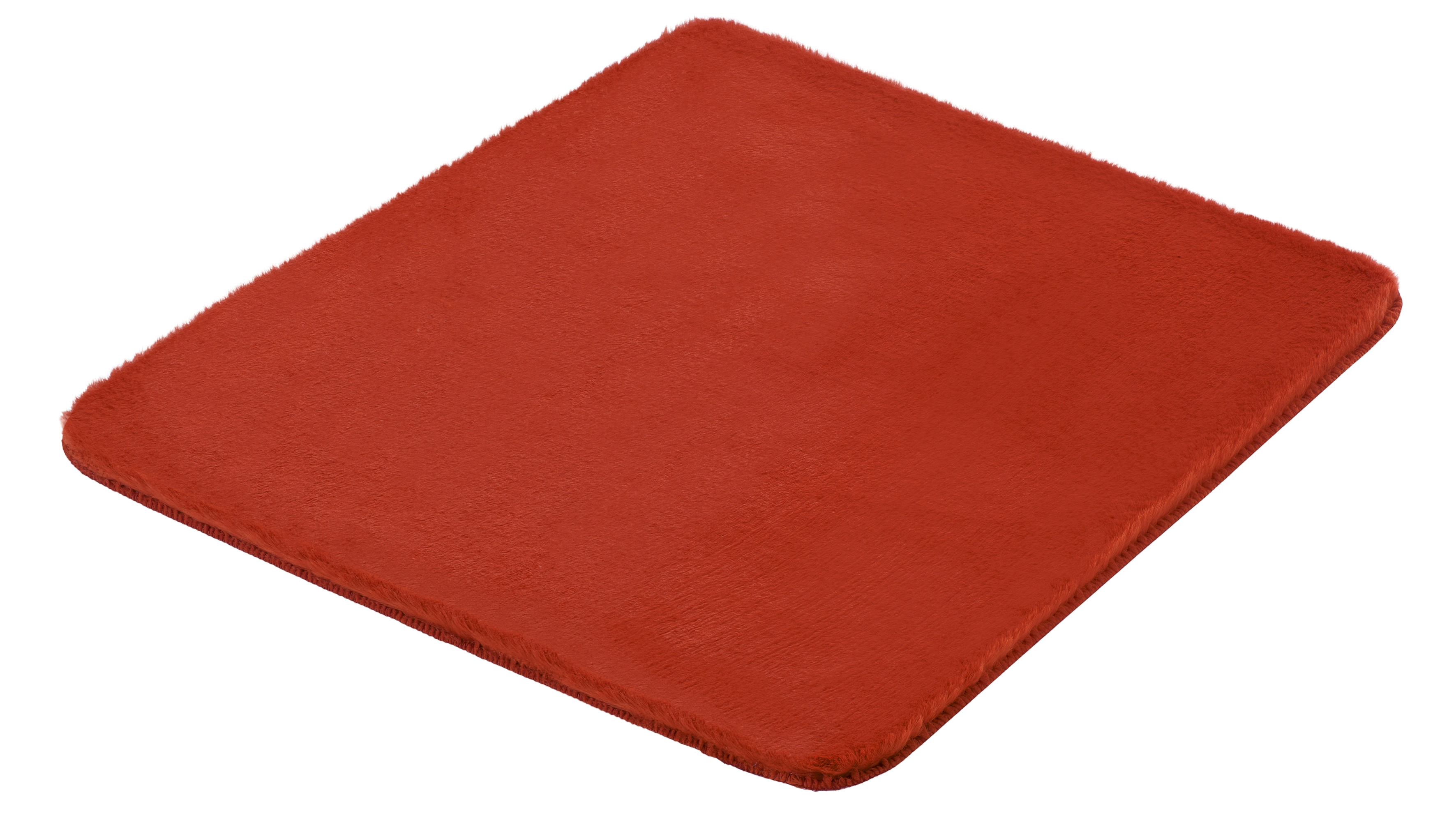 Rote, flauschige Badematte in quadratischer Form, ideal für ein gemütliches Badezimmerambiente.
